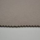 Tissu ciel de toit gris argenté, maille texturée, bord découpé en dents de scie. Grande largeur.